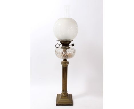 Early 20th century Corinthian column form brass oil lamp with etched globular glass shade and faceted reservoir, total height