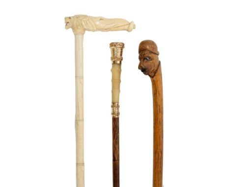 Late 19th century carved ivory walking stick with carved elephant and lion-head handle and sectional tapered shaft, 90cm high