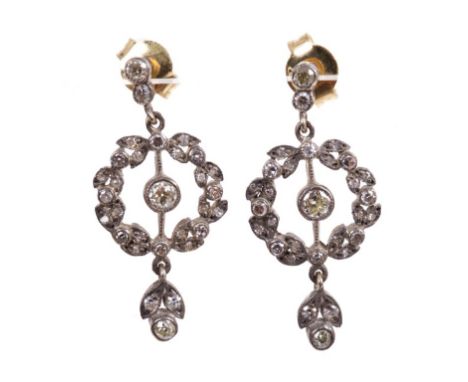 Pair of Belle Epoque style diamond pendant earrings each in the form of a foliate wreath with an old cut diamond to the centr