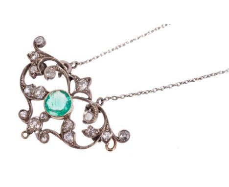 Edwardian emerald and diamond pendant necklace, the openwork foliate scroll plaque with a central round mixed cut emerald and