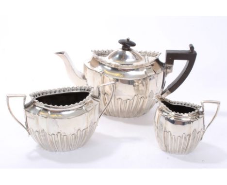 Victorian silver three piece tea set - comprising teapot of panelled form, with half-fluted decoration, gadrooned style rim, 