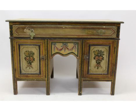 Antique painted pine kneehole dressing table with frieze drawer and commode drawer flanked by cupboards, painted with floral 