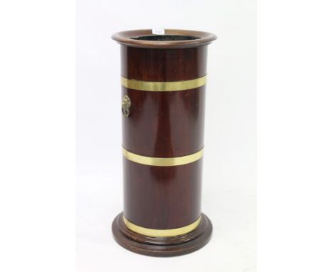 Good mahogany and brass bound cylindrical stick stand with everted rim and tin liner, on stepped base, 67cm high