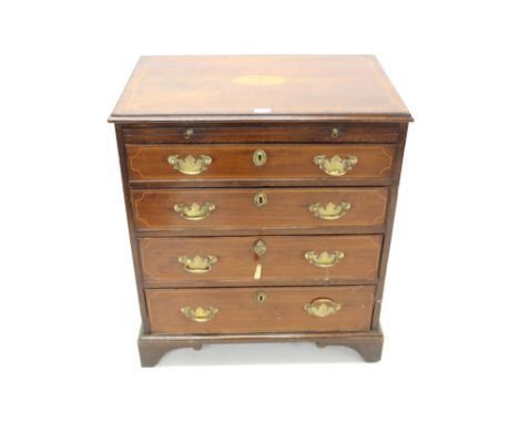 George III mahogany and boxwood line-inlaid dressing chest of small size with brushing slide and four graduated drawers on br