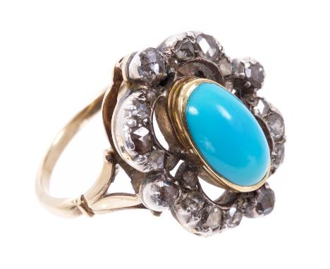 Victorian-style turquoise and diamond cluster ring with an oval turquoise cabochon surrounded by an openwork scalloped border