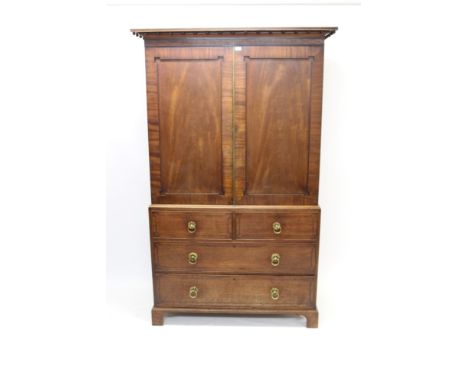Good George IV mahogany and ebony inlaid linen press with ball moulded cornice and interior of slides enclosed by pair of pan