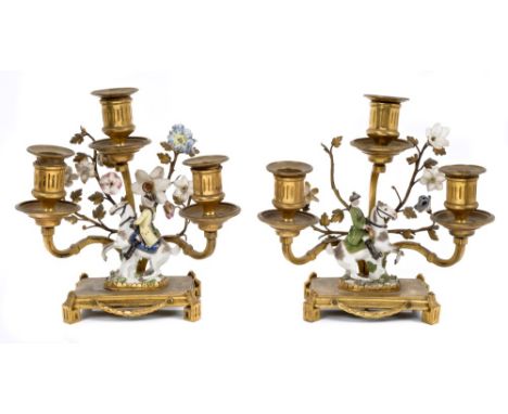 Pair 18th century Meissen miniature equestrian figures, with later gilt metal candelabra mounts, each with floral sprays and 
