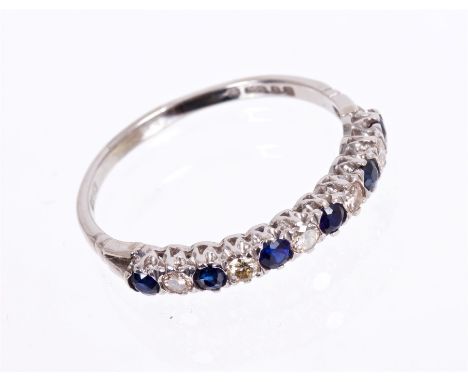 Sapphire and diamond half-hoop eternity ring with five brilliant cut diamonds interspaced by six round mixed cut blue sapphir