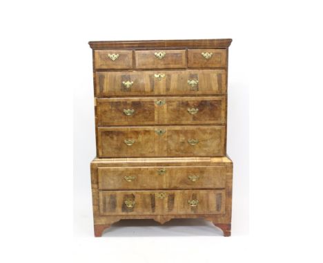 Early 18th century and later walnut chest on stand with moulded cornice and two short over three long graduated drawers, the 