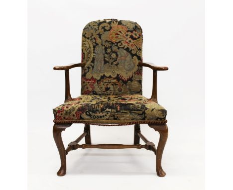 George I style walnut and tapestry upholstered armchair raised on cabriole legs united by an H-stretcher and pad feet
