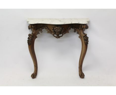 Early Victorian rosewood console table with serpentine-shaped variegated white marble top on floral and foliate scroll carved