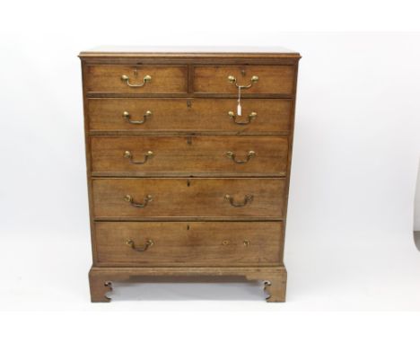 George III oak tall chest in two parts, having two short over four graduated drawers, with hinged acorn escutcheon plates on 
