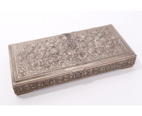 Early 20th century Middle Eastern white metal box of rectangular form, with hinged cover profusely chased with images of bird