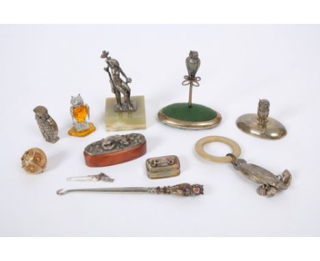 Selection of owl themed novelty silver and white metal - including vesta, child's teething rattle, owl with an amber body, pa