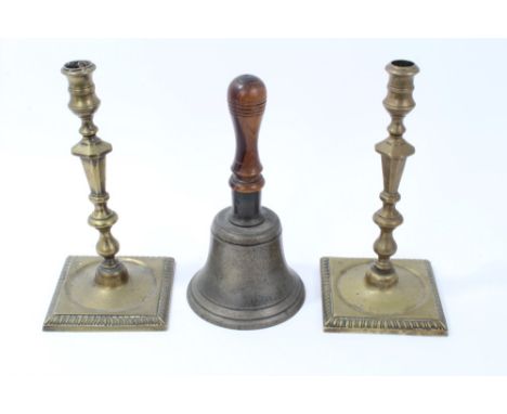 Pair of late 18th / early 19th century brass candlesticks, each with knopped faceted stem, on square foot with gadrooned edge