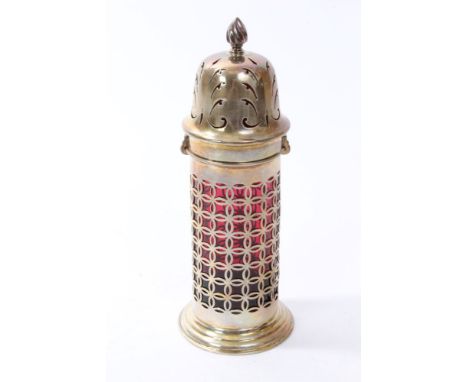 Victorian silver sugar caster of lighthouse form, with diaper work decoration, red glass liner and bayonet fitting, pierced c