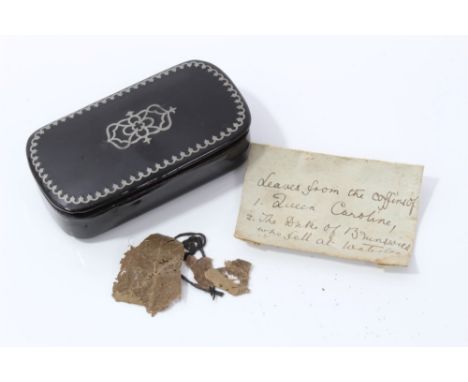 A Memento of Queen Caroline:  Georgian black lacquer and pewter inlaid snuff box containing a folded note containing dried le