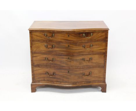 Good George III mahogany serpentine chest of drawers of small size, with moulded top and four graduated drawers, each with or