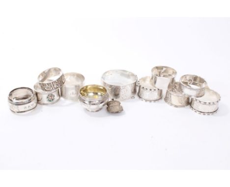 Nine silver napkin rings (various dates and makers), a silver bangle (Chester 1936), Victorian silver salt (marks rubbed) and