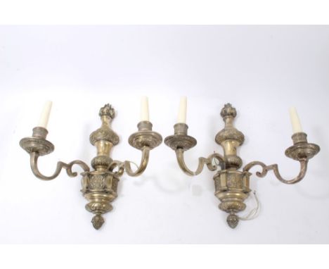 Set of four good quality twin-branch silvered wall lights in the Baroque style, with flaming torch finial and knopped columns