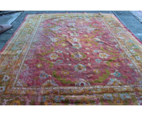 Good Usak-style antique carpet with formal floral meander motif on brick-red ground in conforming borders, 348cm x 250cm