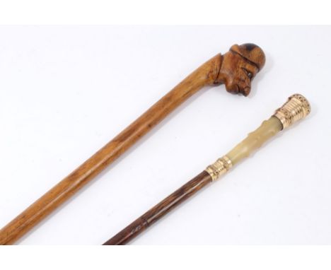 Victorian hardwood novelty walking stick with human head knop and Victorian gilt metal and horn-handled cane (2)