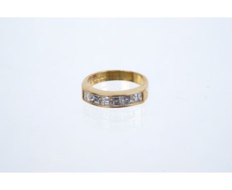 18ct gold diamond eternity ring with a half hoop of 6 emerald cut diamonds in channel setting, ring size K 