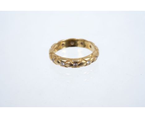 18ct gold wedding ring with plaited design and set with 12 brilliant cut diamonds, ring size K
