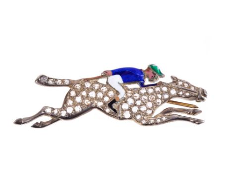 Novelty gold, diamond and enamel brooch in the form of a jockey on a racehorse, the jockey decorated in polychrome enamels an