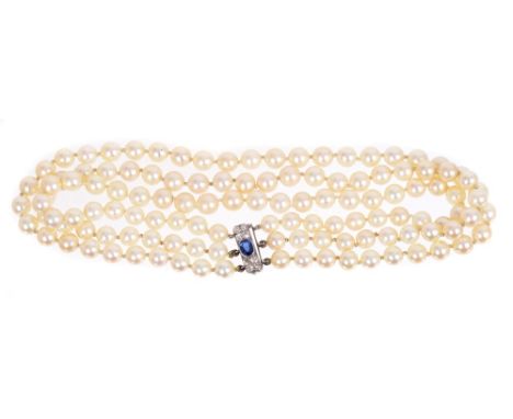 Cultured pearl triple row necklace with three strings of cultured pearls measuring approximately 7.1 - 7.9mm diameter, on a s
