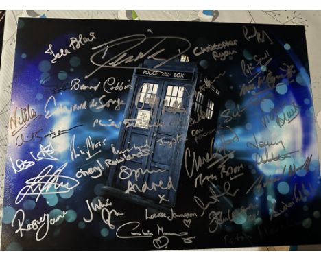 Doctor Who 16x12 inch Tardis photo signed by over THIRTY actors who have played various characters in the series over the yea