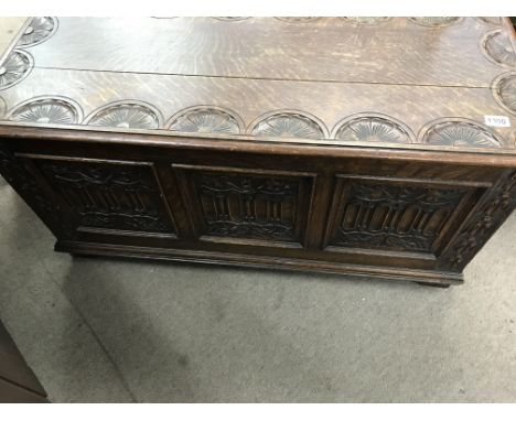 A oak blanket box with carved panel front - NO RESERVE