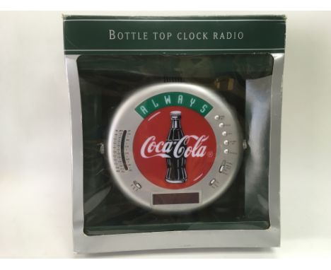 A boxed Coca Cola bottle top clock radio - NO RESERVE