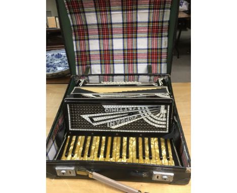 A cased Settimio accordion.