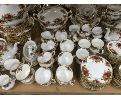 A royal Albert country rose tea, dinner service including tureens plates cups and saucers 140 pieces approx