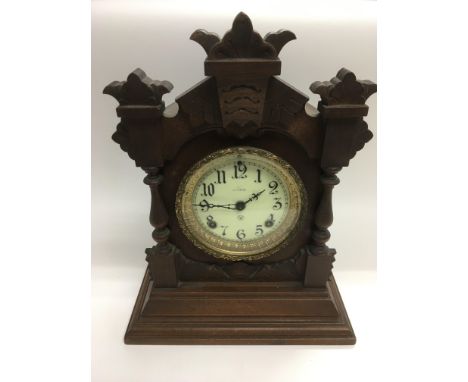 A mahogany cased 8 day mantle clock, approx height 36.5cm.