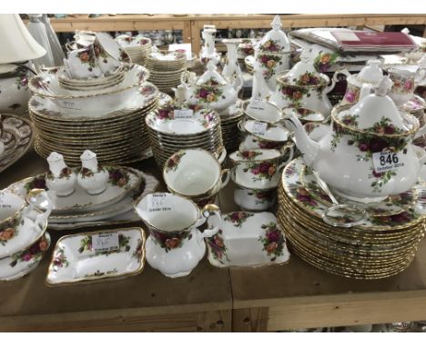A Collection of royal Albert country rose Including cups saucers dinner plates tea pot cruets