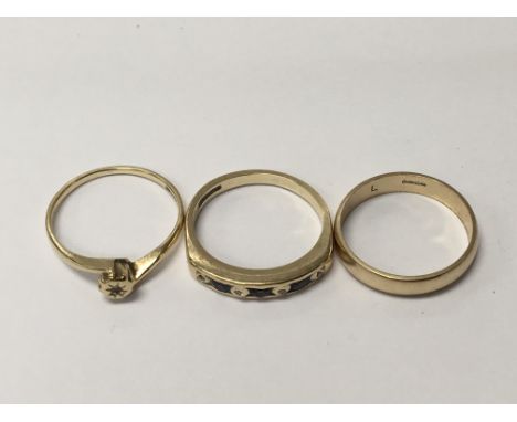 Three 9carat gold rings set with small diamonds blue sapphire and other stones. Weight 5g ring size K.