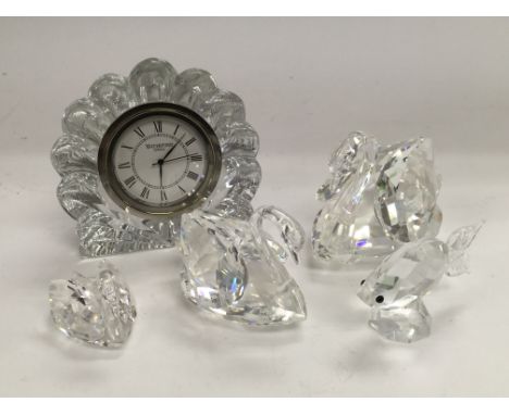 Three Swarovski swans, Waterford crystal clock and a fish (5).