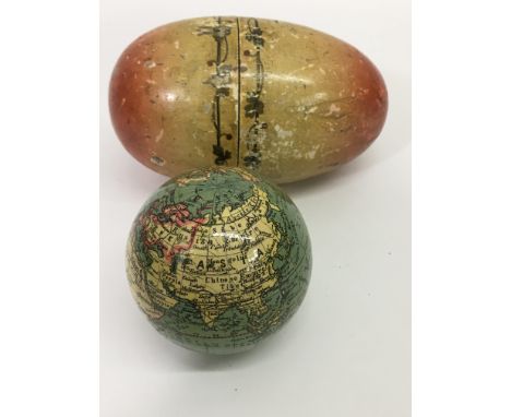 A 19th century German papier-mâché globe in wooden egg