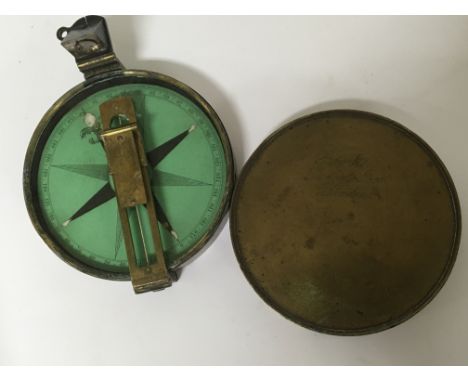 A 19th century oxidised brass cased compass maker Brooks Ludgate Street London. Diameter 9.5cm.