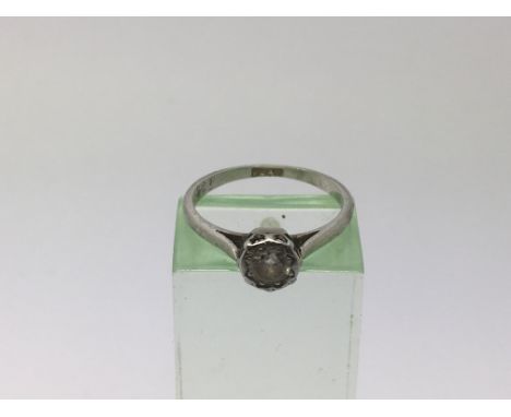 A platinum ring inset with a Moissanite, approx 2.7g and approx size K.