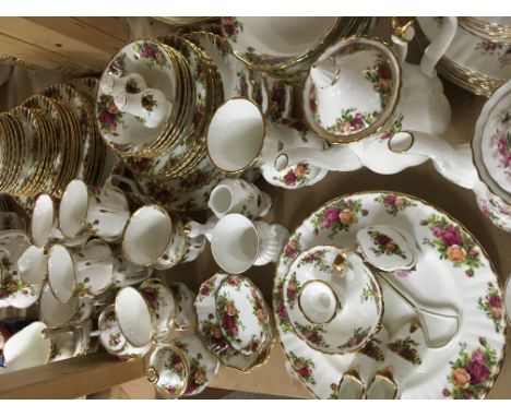 A collection of royal Albert country rose including cups saucers meet plates bowls