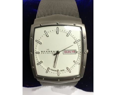 A gent's Skagen watch with square face and titanium woven strap