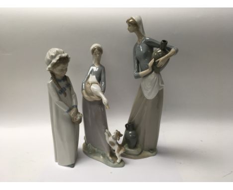 Two lladro figures and a nao figure