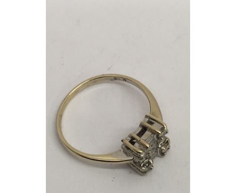 An 18ct white gold, square cut cluster ring.Approx size K