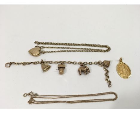 A 9ct gold charm bracelet and yellow metal necklaces, approx 27g.