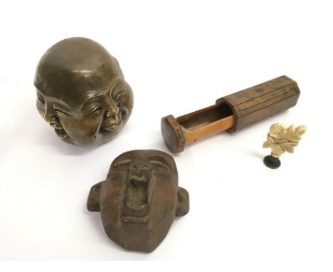 A Chinese brass four face Buddha, a carved wood face, Victorian ivory seal and a treen case