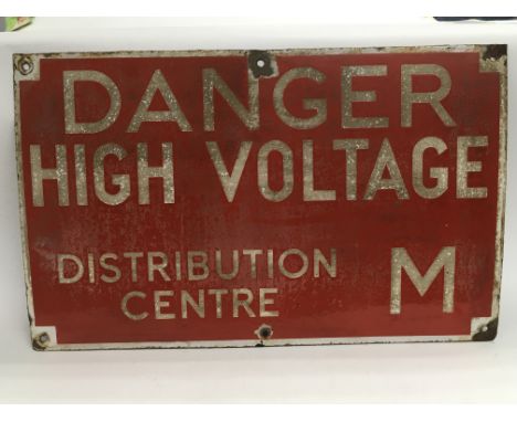 A vintage enamel warning sign 'Danger high voltage', approx 61cm x 37.5cm.