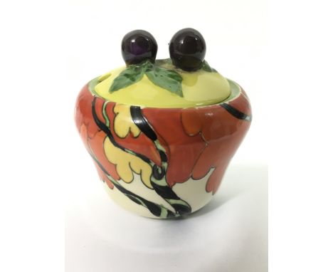 A Clarice Cliff, ' Fantasque, Honolulu' pattern preserve pot.Approx 6cm high, matched lid
